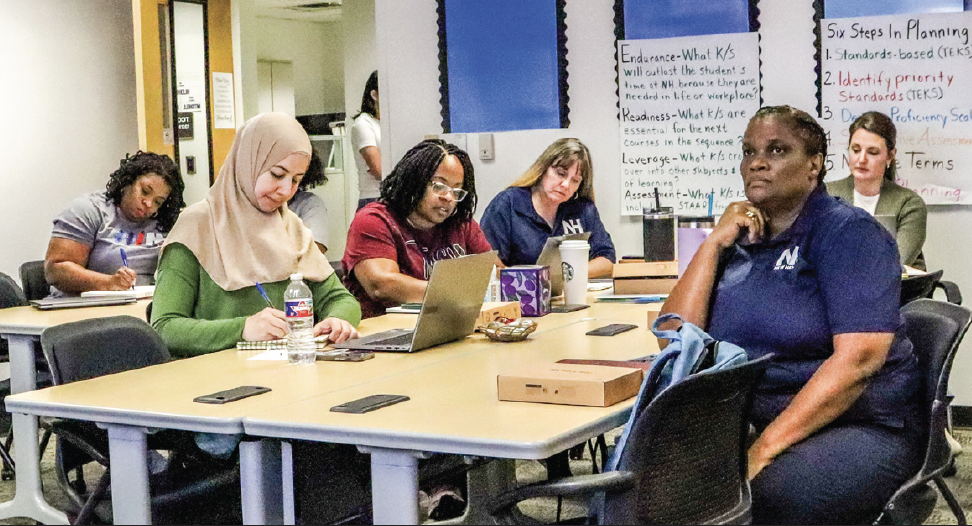 TCC New Heights faculty discuss student progress in the New Heights at a faculty meeting.